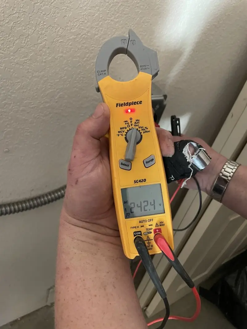 Voltage testing with clamp meter during Aluminum Wiring Replacement in St. Martin